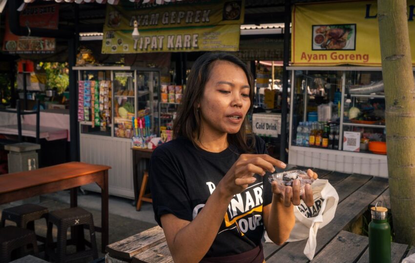 tour guide explaining a dish at the night market