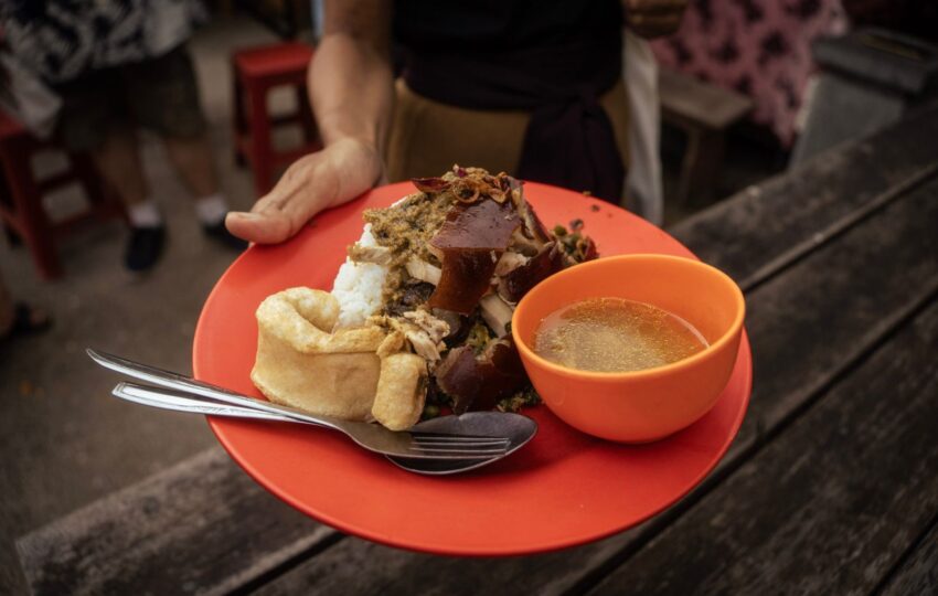 a plate of nasi and babi guling